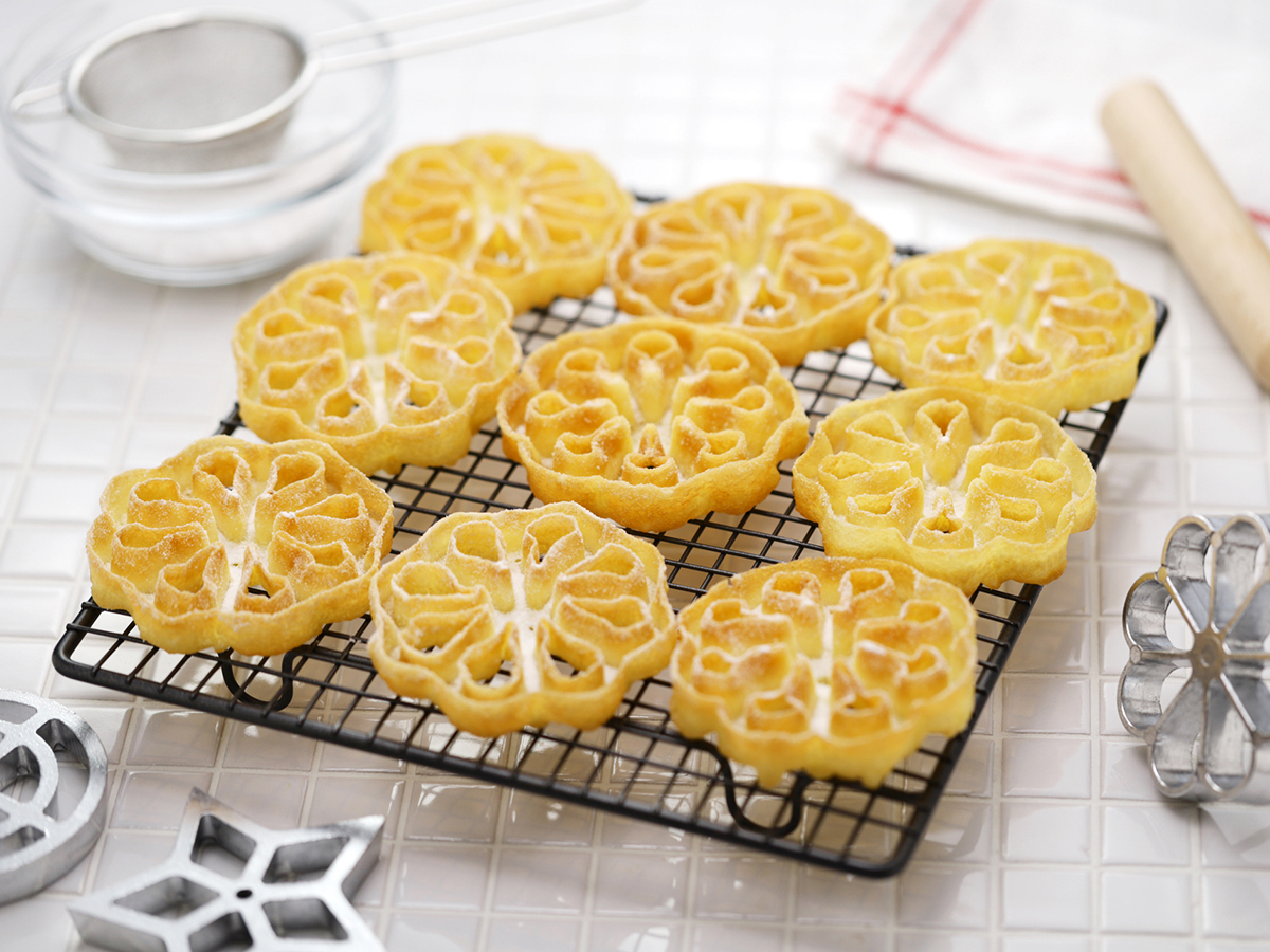 Rosettes, lacy Scandinavian fried cookies dusted with sugar