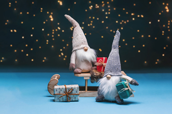 Scandinavian tomte figures with long white beards and red knitted hats